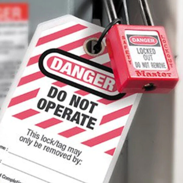 Lockout tagout safety lock and tag on machinery indicating maintenance in progress